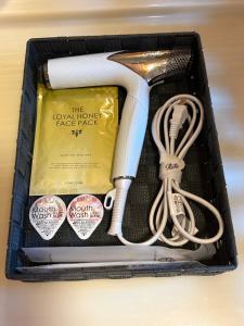 a box with various items in it at Anan Seaside House in Anan