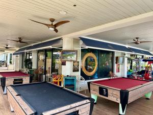 a room with two ping pong tables in it at Caribbean Loft - SXM in Anse Marcel 