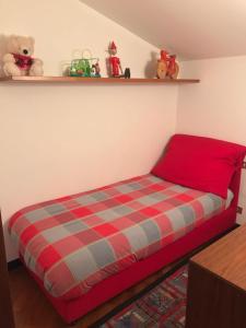 A bed or beds in a room at Appartamento Bernasconi