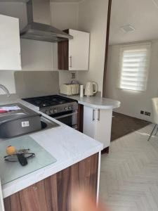 a kitchen with a stove and a counter top at Nancy staycation in Clacton-on-Sea