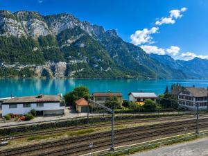 a view of a lake with mountains in the background at Lake House in Mühlehorn +2 photos