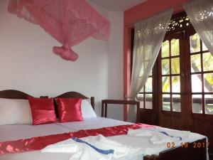 Postel nebo postele na pokoji v ubytování Raja174 Homestay