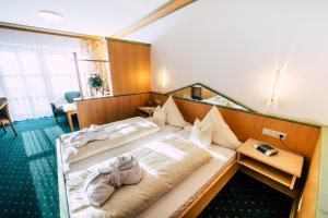 Postel nebo postele na pokoji v ubytování Wellness- und Wohlfühlhotel Waldeck