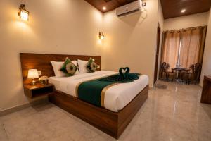 a bedroom with a large bed in a room at Hotel Ganga MBS Rishikesh # Best location # Family Hotel in Rishīkesh