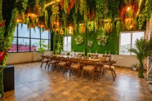 a dining room with a long table and chairs at Hotel Ganga MBS Rishikesh # Best location # Family Hotel in Rishīkesh