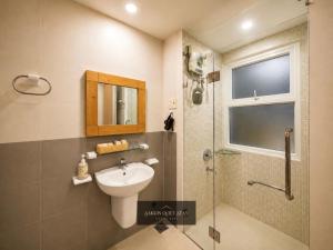 a bathroom with a sink and a shower and a toilet at Saigon Quiet Stay in Ho Chi Minh City