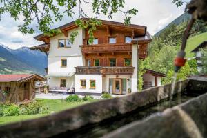 a house with a fence in front of it at Untersillerhof in Neustift im Stubaital