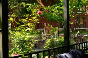 a view of a garden with a statue of a rabbit at Wald Hotel N1 Building in Lagodekhi