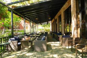 a row of tables and chairs on a patio at Wald Hotel N1 Building in Lagodekhi