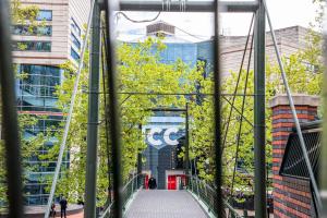 a glass bridge in front of a building at Staybridge Suites Birmingham by IHG in Birmingham