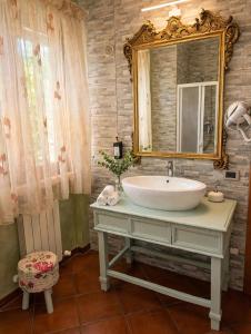 a bathroom with a sink and a mirror at La Mammola Bed&Breakfast in Fabriano +32 photos