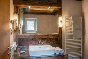 a bathroom with a sink and a mirror at Untersillerhof in Neustift im Stubaital