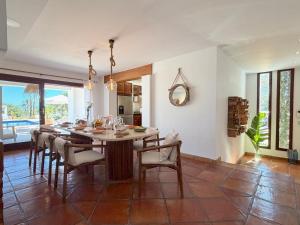 a dining room with a table and chairs at Can Paola in Sant Josep