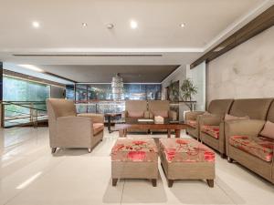 a living room with couches and a table at Guide Hotel Taipei Bade in Taipei