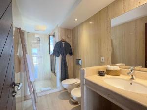 a bathroom with a sink and a toilet and a shower at Can Paola in Sant Josep +34 photos
