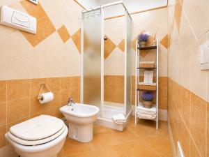 a bathroom with a toilet and a shower at Quiet Home in Pula