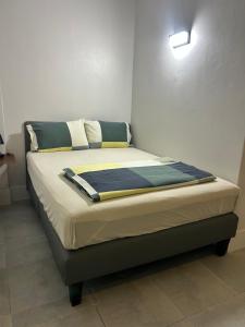 a bed sitting in a room with at Island House Rentals 40 in Ko Samed +14 photos