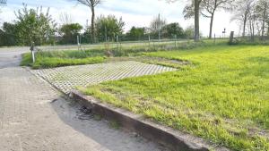 a bench sitting on the side of a road at La Hasienda in Geldern