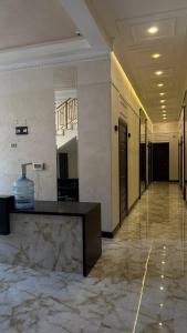 a lobby with a reception desk in a building at Monro in Odesa