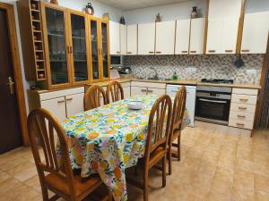 a kitchen with a table with a table cloth on it at Mas Panoli in Deltebre