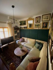 a living room with a couch and a table at Legendarium Casa Rural in Salamón