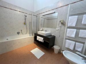 a bathroom with a sink and a shower and a tub at Hotel Stocker in San Valentino alla Muta +52 photos