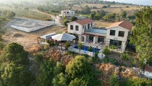 an aerial view of a house on a hill at LasaThea in Lasa +1 photo