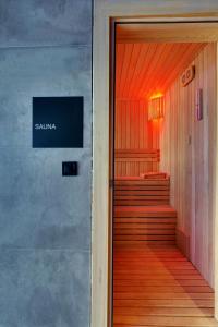 a door to a building with a sign that reads santa ana at Grande Arte Hotel in Eskisehir +7 photos