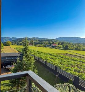 a view of a farm from the balcony of a house at Zoe Luxury House in Gomirje
