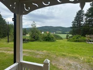 a view of a yard from a window of a house at Nordic Villa Undrom in Undrom