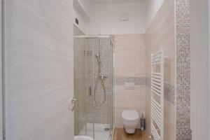 a bathroom with a shower and a toilet at Hotel IL MORO in Roseto degli Abruzzi