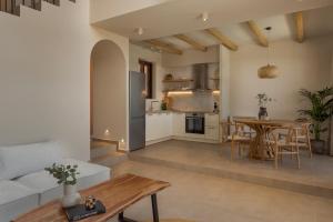 a living room and kitchen with a table and chairs at Don Gerassimo in Argostoli