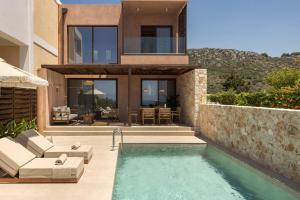a villa with a swimming pool and a house at Don Gerassimo in Argostoli