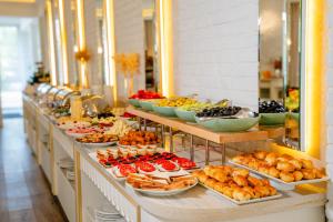 a buffet line with many different types of food at AlmaBagi Hotel&Villas in Quba