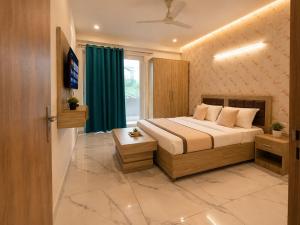 a bedroom with a large bed and a window at Hotel Akshay dream stay in Gurgaon