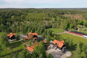 an aerial view of a house in a forest at Ulkeröds Gård in Hedekas
