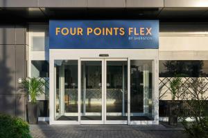 a front door of a four points flux building at Four Points Flex by Sheraton Bologna Airport in Bologna