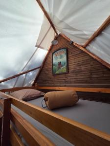 a boat with a poster on the side of it at Destination Ailleurs eco-domaine & spa in Castellane