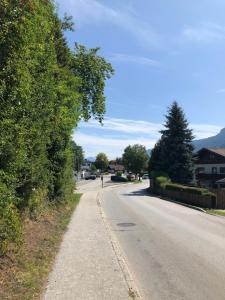 an empty street with trees on the side of the road at Vassal and breakfast Als in Voldöpp
