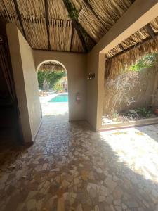 an entry way to a villa with a pool at Lagun Paradise Curacao in Willemstad