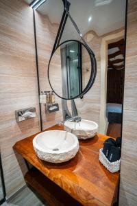 a bathroom with a sink and a mirror at Хотел Дом на Алпиниста in Vratsa +17 photos