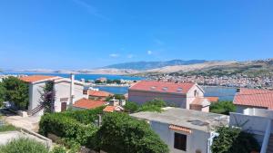 a view of the city and the water at Apartments Pag Holiday in Pag
