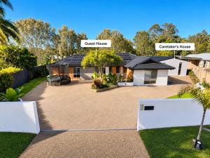 a house with the names of the houses at Peaceful tropical retreat with pool, mineral spa & Games room in Gold Coast