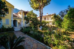 a view of the house from the garden at İlkiz Beach Hotel in Oludeniz