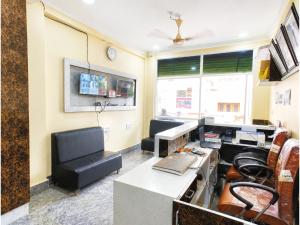 an office with a desk and chairs in a room at The Annapurna Resort Hotel & Restaurant - Walking From 100m From Sea Beach, Free Wifi, Parking Available ! Luxury & Best Hotel in Puri in Puri