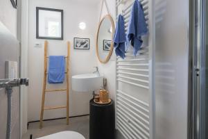 a bathroom with a toilet and a sink at The Como Pet Nest in Laglio
