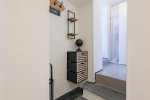 a hallway with a staircase leading into a house at The Como Pet Nest in Laglio