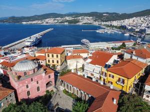 an aerial view of a town next to the water at Kallichoron 3 fortezza Kavala in Kavála