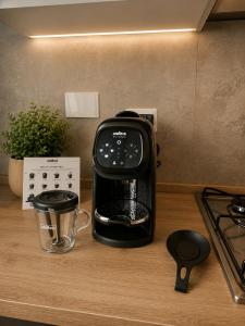 a toaster sitting on top of a kitchen counter at Le Bonbon in Trevignano Romano +8 photos