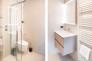 a bathroom with a toilet and a glass shower at Villa Sonia in Bardolino +36 photos